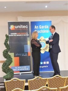 Michelle, from the Unitec team, chats with a member of Clonmel's Garda at the Garda Fraud & Cyber Crime Prevention Seminar in February 2020